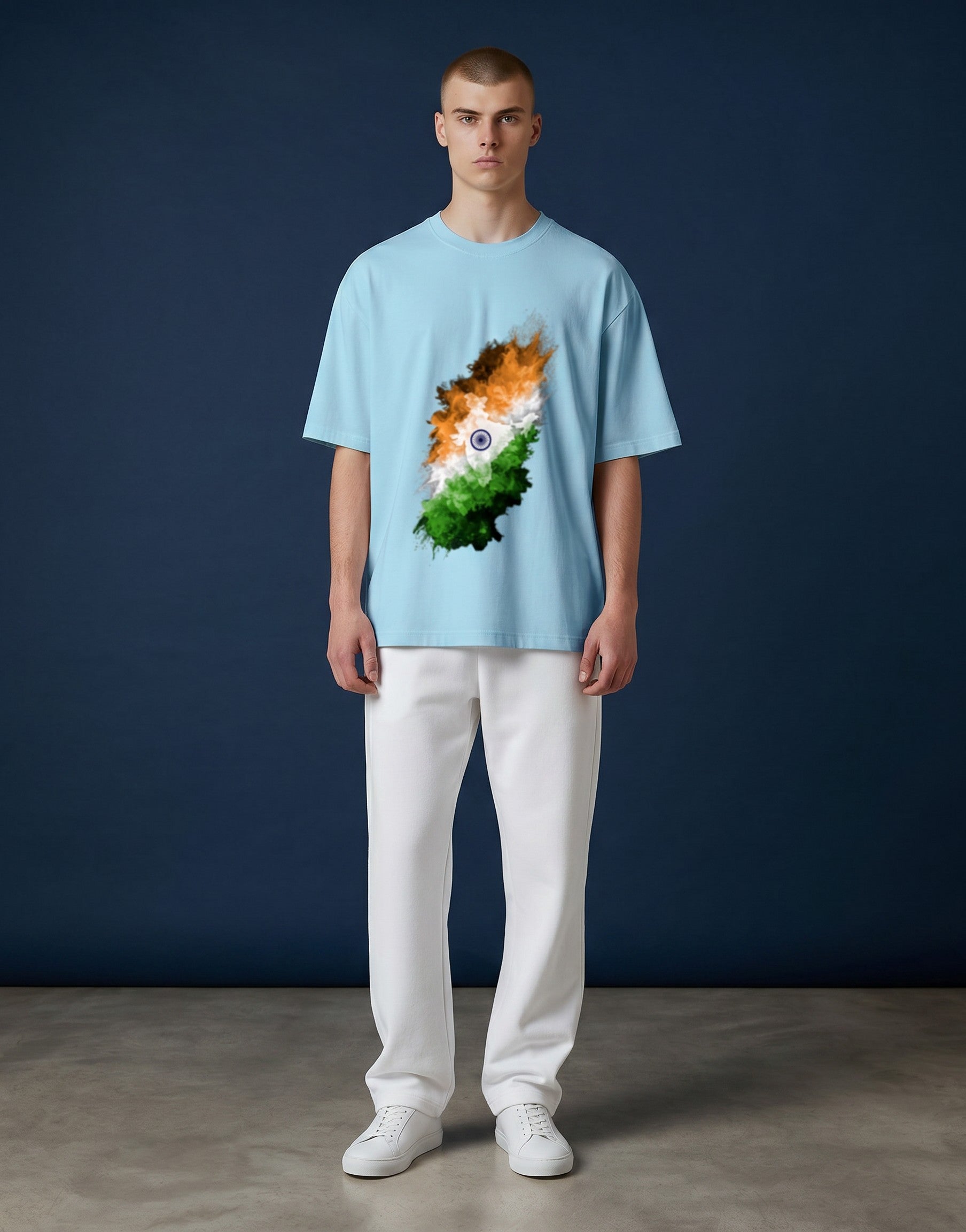A&G light blue 100% cotton unisex oversized t-shirt with a graphic print of the Indian flag in a splash art style.