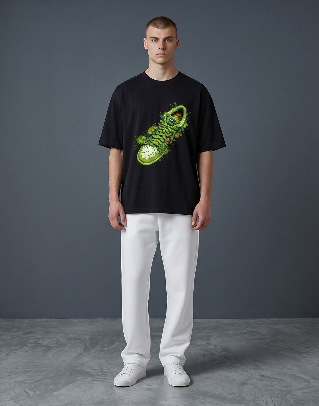 A&G black 100% cotton oversized t-shirt with a vibrant green sneaker graphic and paint splatter.